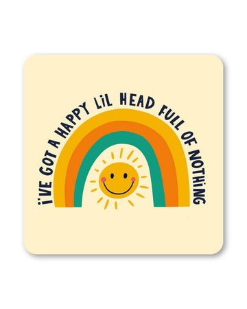 Square cream coaster with a retro rainbow arch and a yellow smiley sun in the middle. Black text reads “I’ve got a happy lil head full of nothing” around the design.