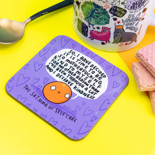 Satsuma of Self Care Coaster is a purple coaster with heart background and an illustrated satsuma smiling with a speech bubble saying 'So, Have decided it is time to be so motherfucking kind to myself for no other reason than I've been through a lot and I deserve Kindness.'