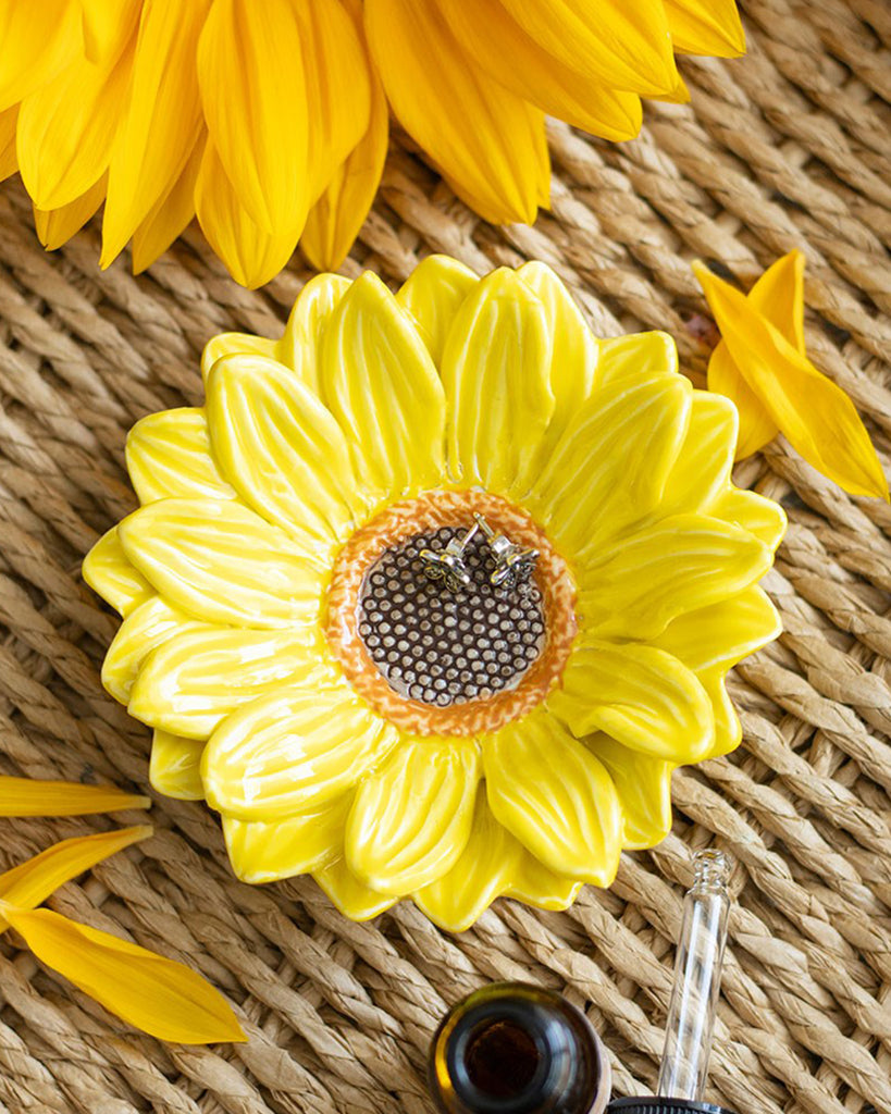 Product packaging featuring the sunflower trinket dish with rustic styling and a sunflower-themed box design.