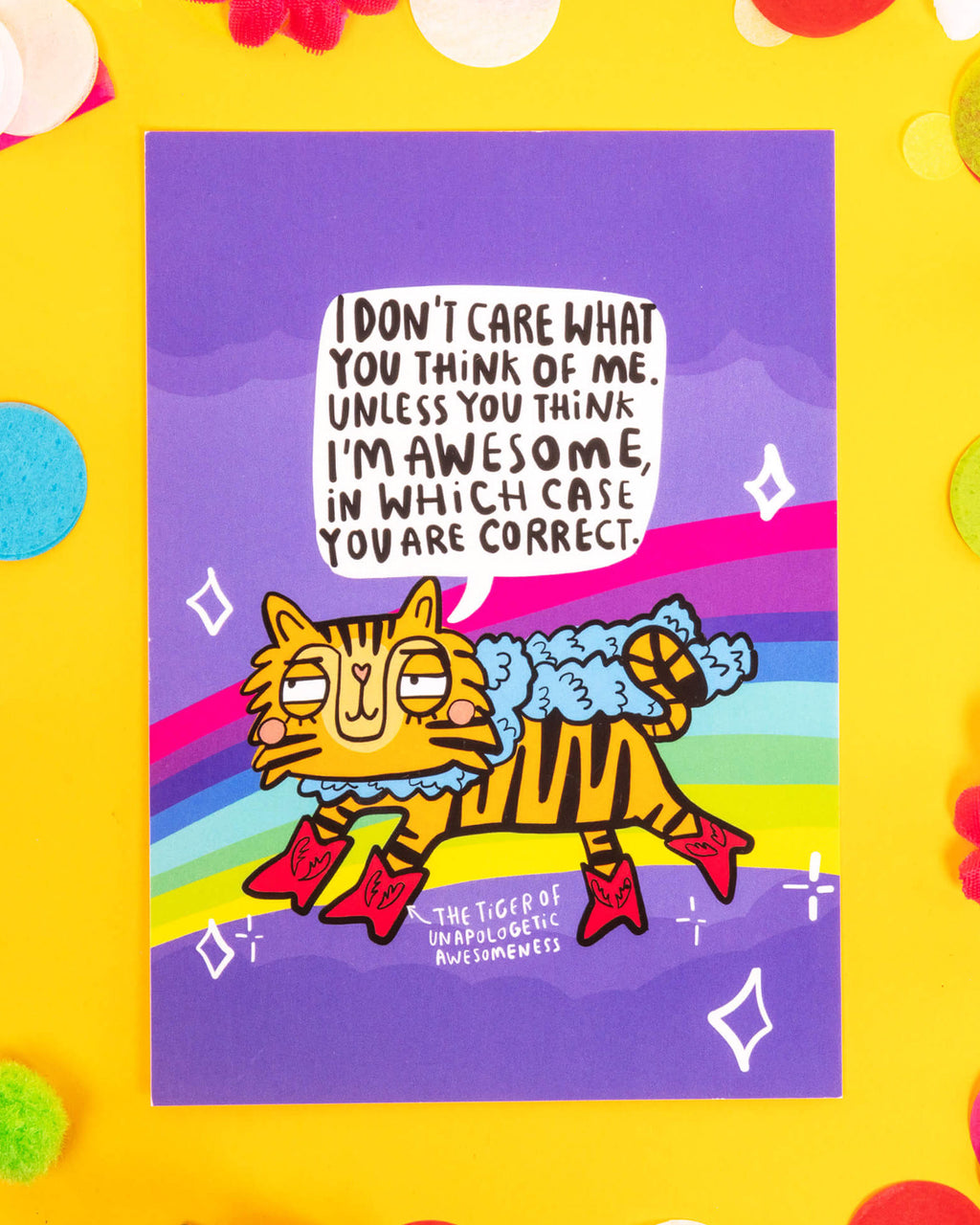 A colourful A6 postcard featuring a cartoon tiger in red boots with the text, “I don’t care what you think of me. Unless you think I’m awesome, in which case you are correct.” Designed by Katie Abey, this motivational rainbow postcard is perfect for millennials into alternative fashion, dopamine dressing, and unapologetic self-love.