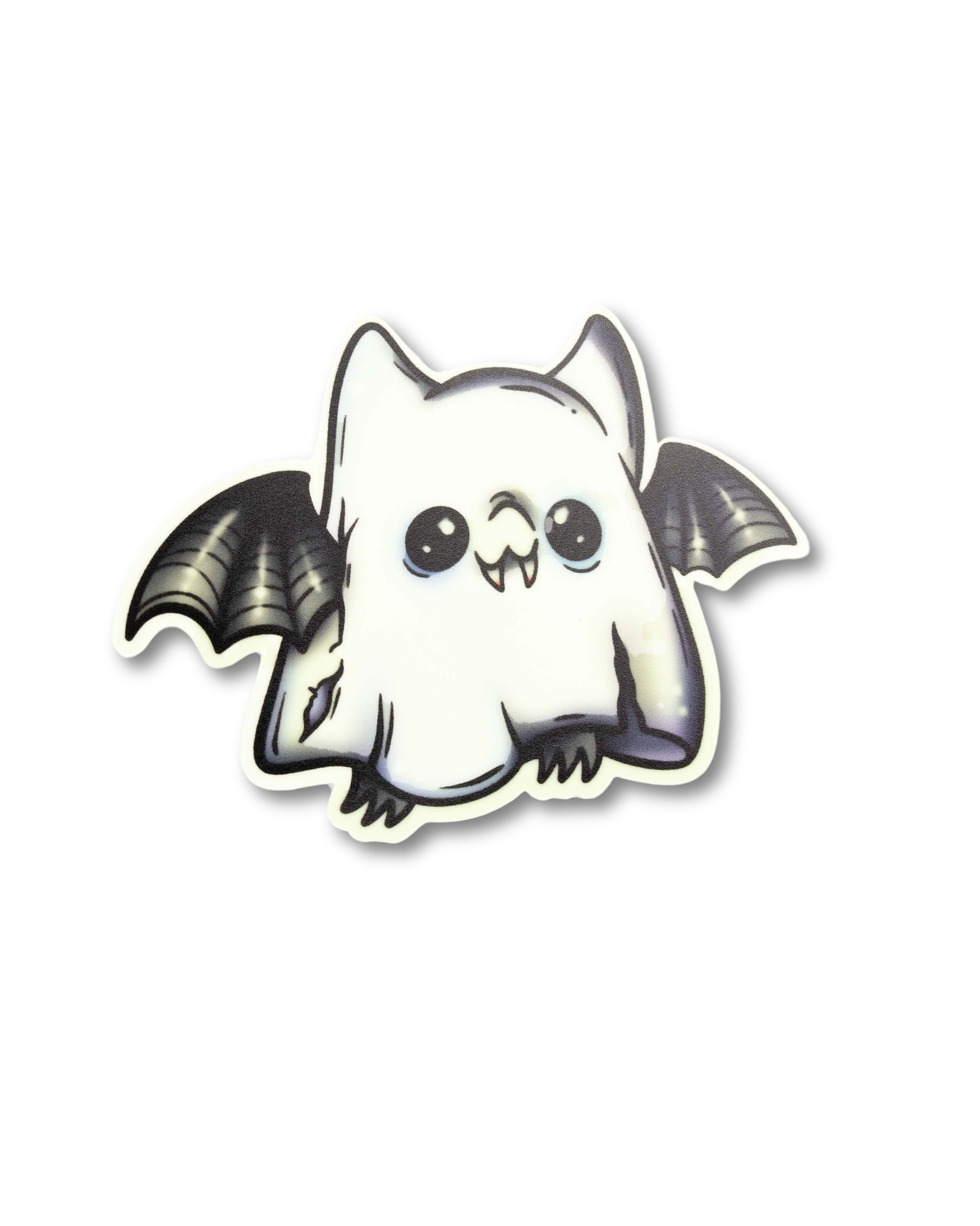 Glow in the dark smiling bat wearing a ghost costume sticker. A cute and spooky goth style sticker gift.