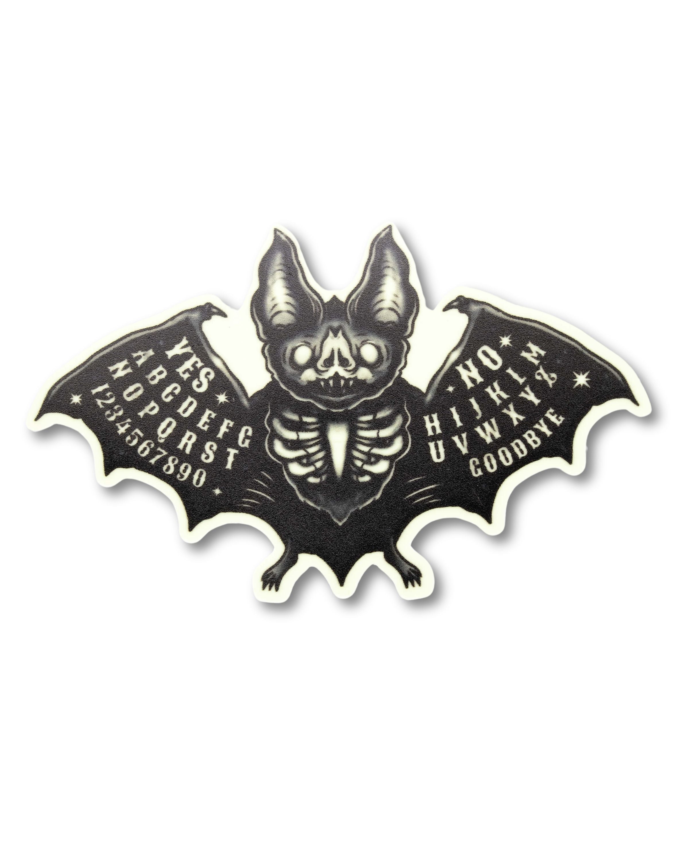Glow in the dark bat sticker with ouija board detailing on the wings and white outline. Goth style and witchy sticker. 