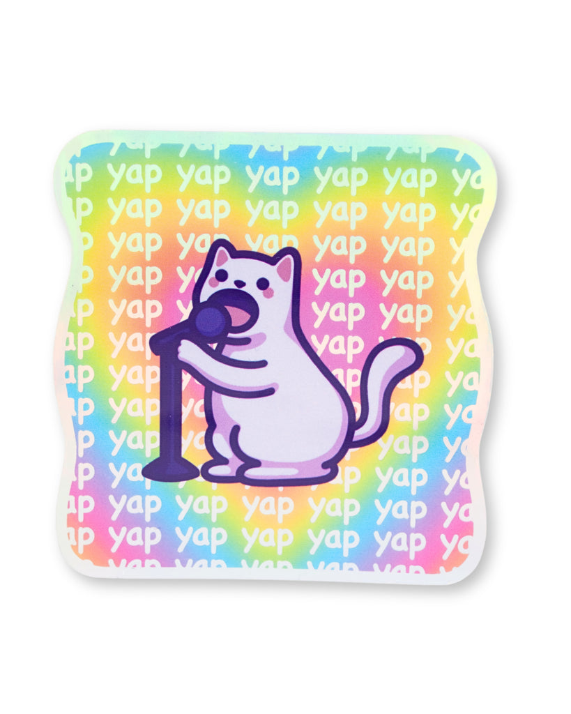 Funny holographic vinyl sticker by Mona Mauve featuring a cartoon cat holding a microphone with a rainbow background repeating the word yap holographic shine visible in sunlight perfect for laptops and water bottles