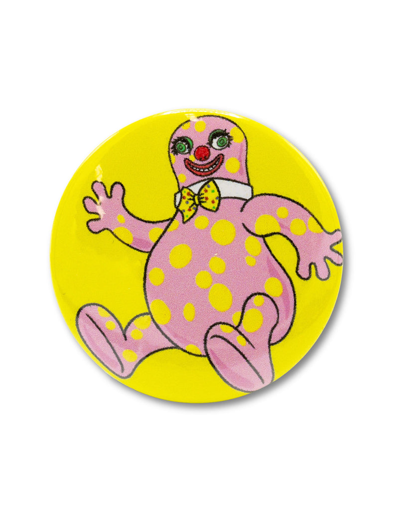 Yellow button badge with an 80s icon, mr blobby, a pink and yellow polka dot character smiling wearing a bow tie. Retro inspired design from Bite Your Granny.