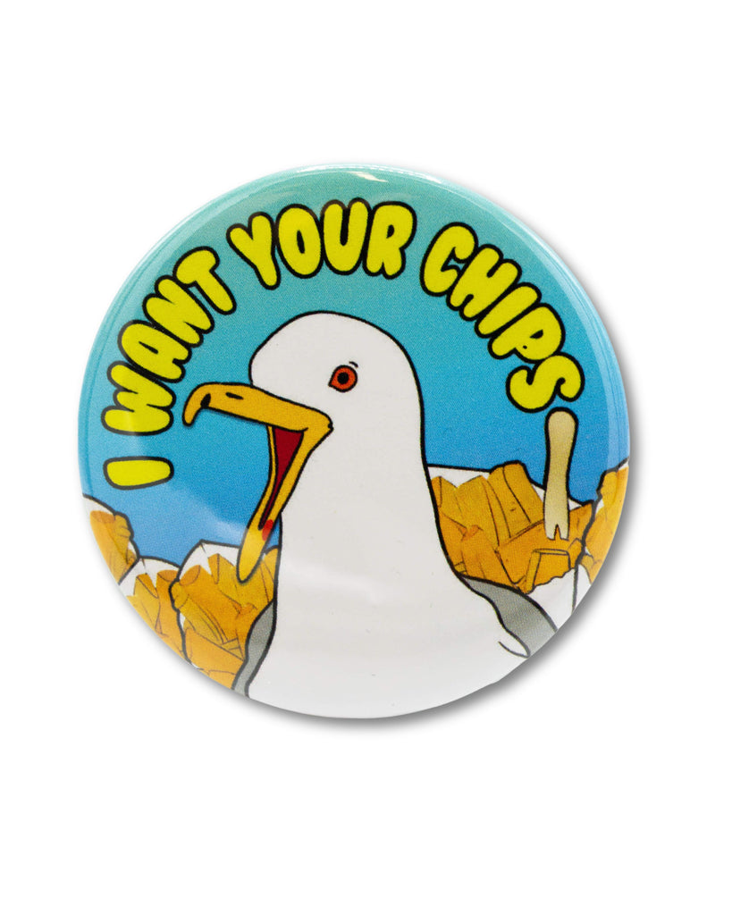 Blue gradient button badge with a cartoon screaming seagull with seaside chip cones behind and yellow bubble writing that reads 'I want your chips'. A retro inspired design from Bite Your Granny.