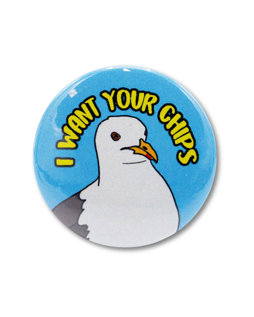 Blue button badge with a seagull head and yellow text that reads 'I want your chips'. Retro inspired seaside design from Bite Your Granny.
