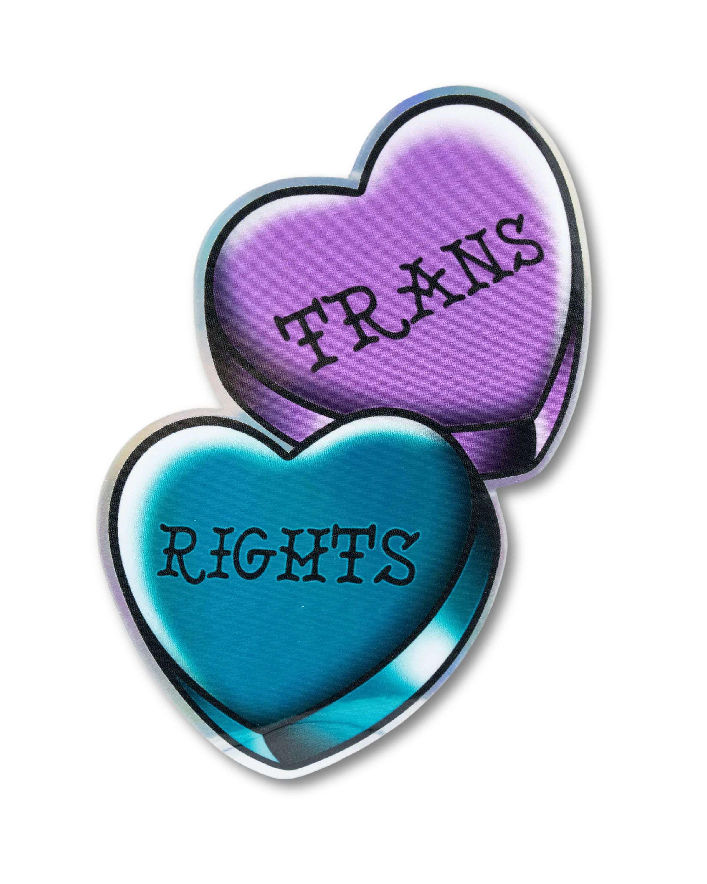 Two tattoo style hearts in purple and blue that read 'trans rights' in black with a holographic rainbow finish sticker. Perfect for LGBTQIA+ pride events.