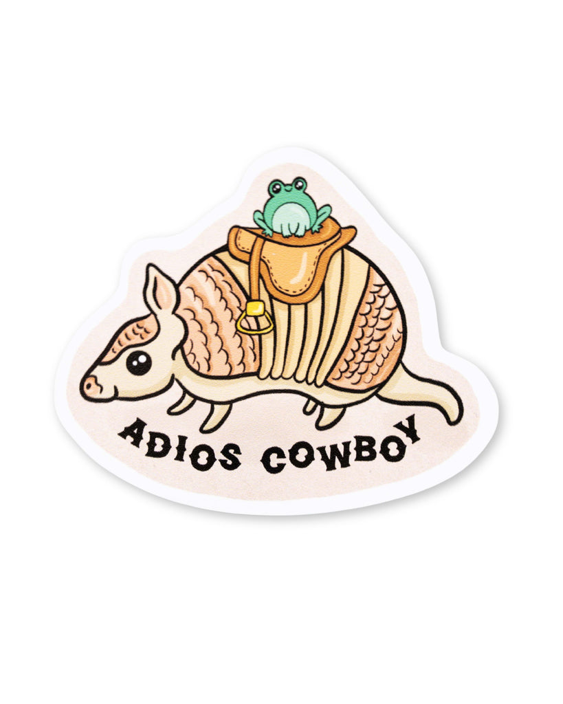 Yasmin cousins vinyl sticker of a cute aardvark wearing a saddle and a smiling kawaii frog with black text underneath reading 'adios cowboy'.