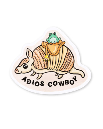 Yasmin cousins vinyl sticker of a cute aardvark wearing a saddle and a smiling kawaii frog with black text underneath reading 'adios cowboy'.
