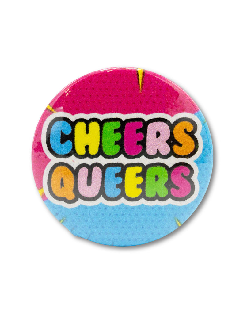 A pink and blue button badge with 'Cheers Queers' text in rainbow bubble writing. A retro inspired and drag race themed design from Bite Your Granny.