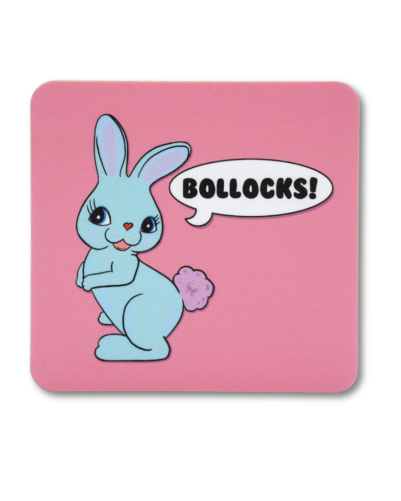 Pastel pink wooden coaster with a pastel blue kitsch rabbit with a speech bubble that reads 'Bollocks!'. A retro kitschy design from Bite Your Granny.