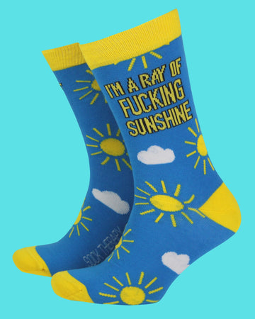 Pair of blue and yellow Rebel Romance bamboo socks with sun and cloud illustrations and the bold slogan “I’m a ray of fucking sunshine” in black and yellow text. Fun, eco-friendly socks in UK size 8–11 for those with a cheeky sense of humour. Designed by a UK small business celebrating alternative style, comfort, and expressive fashion.