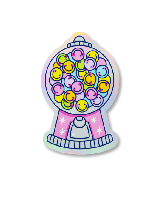 A holographic vinyl sticker from Rebel Romance shaped like a retro gum ball machine filled with colourful smiley faces. The design features pastel tones with pink, yellow, purple, green, and blue smiley balls inside a shiny bubble, with sparkly white stars on the base. Perfect for laptops, water bottles, or notebooks. A fun, nostalgic sticker by a UK indie brand celebrating alternative aesthetics.