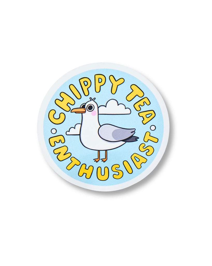 Circular glossy sticker from Rebel Romance featuring a cartoon seagull with the words “Chippy Tea Enthusiast” in bold yellow text. Set against a blue sky with white clouds, this illustrated design by Kellylou celebrates your love for the great British chippy tea. Fun and quirky gift for takeaway fans and seagull lovers.