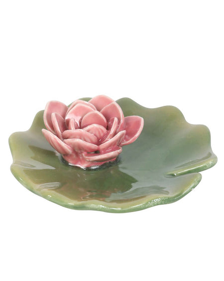 Overhead view of a ceramic lily pad trinket dish with a pink water lily incense holder in the centre. The glossy green lily pad has a natural shape with a small cutout edge, while the delicate pink petals of the flower add a charming touch.