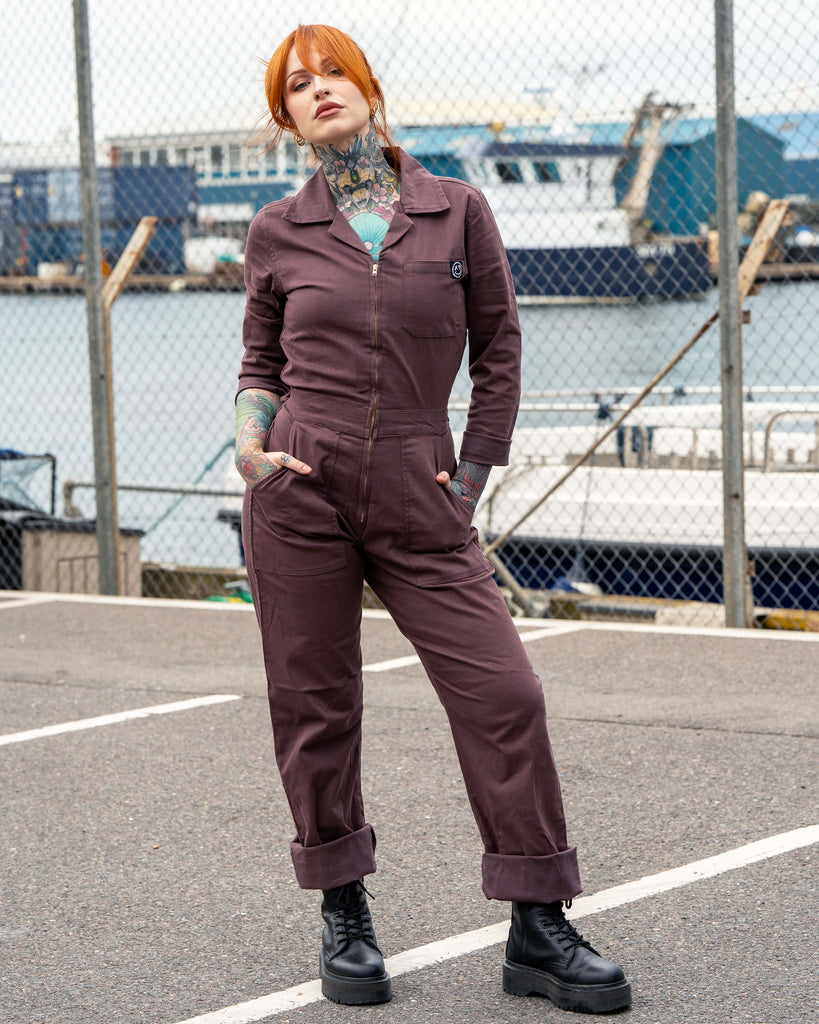Rebel Romance Plum Mocha Boiler Suit modelled by Erin, styled with platform lace-up boots. The utility jumpsuit has a zip front, side pockets and turned-up hems, creating a bold workwear-inspired look perfect for alternative slow fashion.