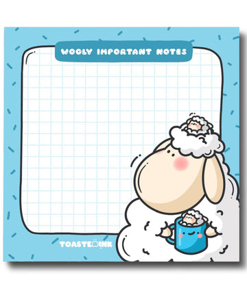 Toastedink sticky note pad from Rebel Romance featuring a cute sheep holding a mug on a fluffy cloud. Blue border with sprinkles, grid paper centre, and the words “Wooly Important Notes”. Displayed on a pastel pink background with stationery.