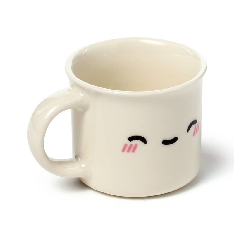 The Foodiemals espresso cup set by Rebel Romance includes two porcelain cups—one with an open-eyed face and one with closed eyes. Perfect for alternative home décor and quirky coffee break vibes.