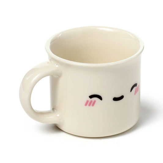 The Foodiemals espresso cup set by Rebel Romance includes two porcelain cups—one with an open-eyed face and one with closed eyes. Perfect for alternative home décor and quirky coffee break vibes.