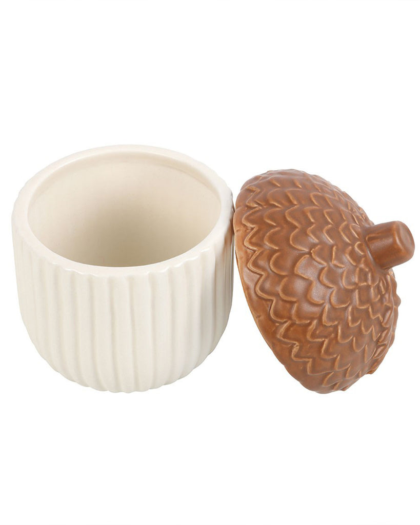 Autumn Acorn Ceramic Storage Jar with lid removed, showing cream ribbed ceramic base. A unique and cosy home accessory by Rebel Romance, perfect for storing autumn treats, jewellery or small essentials.