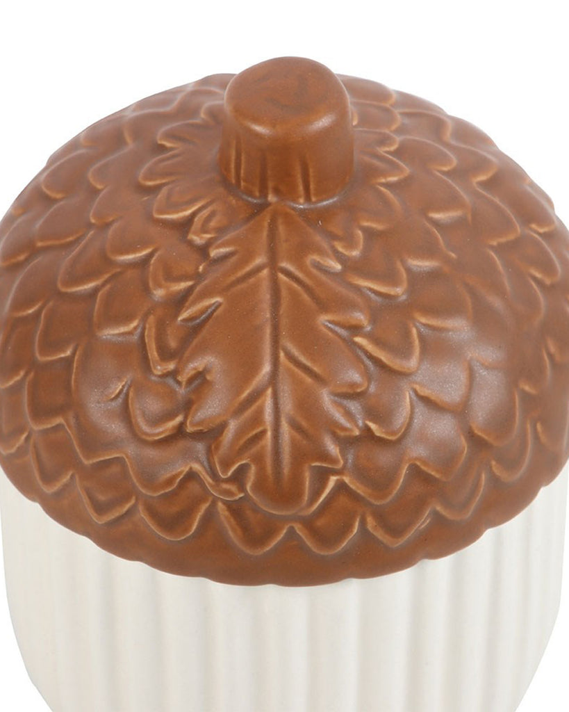Close-up of the Autumn Acorn Ceramic Storage Jar’s brown textured lid featuring leaf and scale detailing. A whimsical homeware piece by Rebel Romance, perfect for adding seasonal charm to your kitchen or shelf.