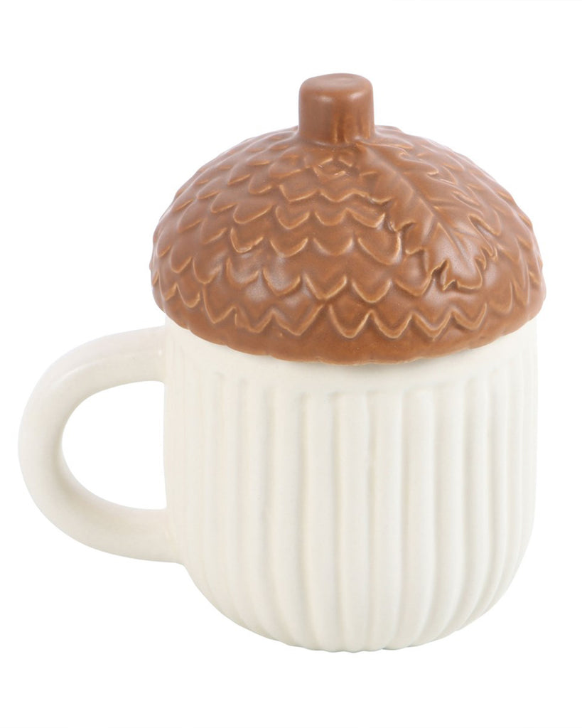Close-up product image of the Rebel Romance Autumn Acorn Shaped Mug. Cream ribbed body with a detailed acorn-style lid, perfect for autumnal drinks and quirky kitchen collections.
