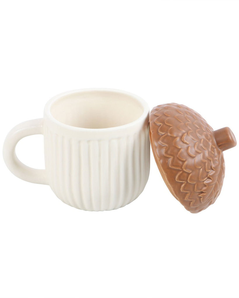 Image of Rebel Romance’s Autumn Acorn Mug with the lid removed, showing the inside of the cream ribbed ceramic mug. A functional and fun piece for cosy beverages.