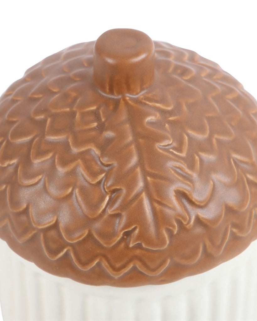 Detailed close-up of the acorn lid on the Rebel Romance Autumn Acorn Shaped Mug. Shows leaf detailing and scale texture, ideal for nature lovers and autumn aesthetics.