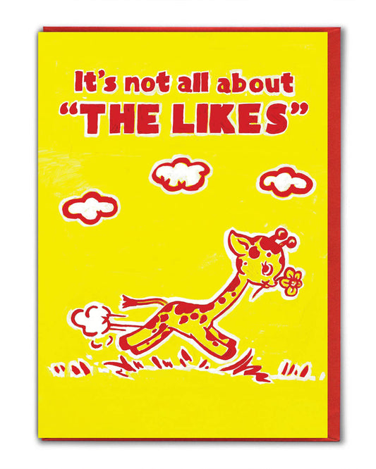 Rebel Romance funny birthday card illustrated by Magda Archer with bold kitsch retro artwork. The design features a cheerful cartoon giraffe holding a flower with the text “It’s not all about THE LIKES” in bright red on a yellow background. A quirky, alternative greeting card perfect for millennials who love humour, nostalgia, and bold design.