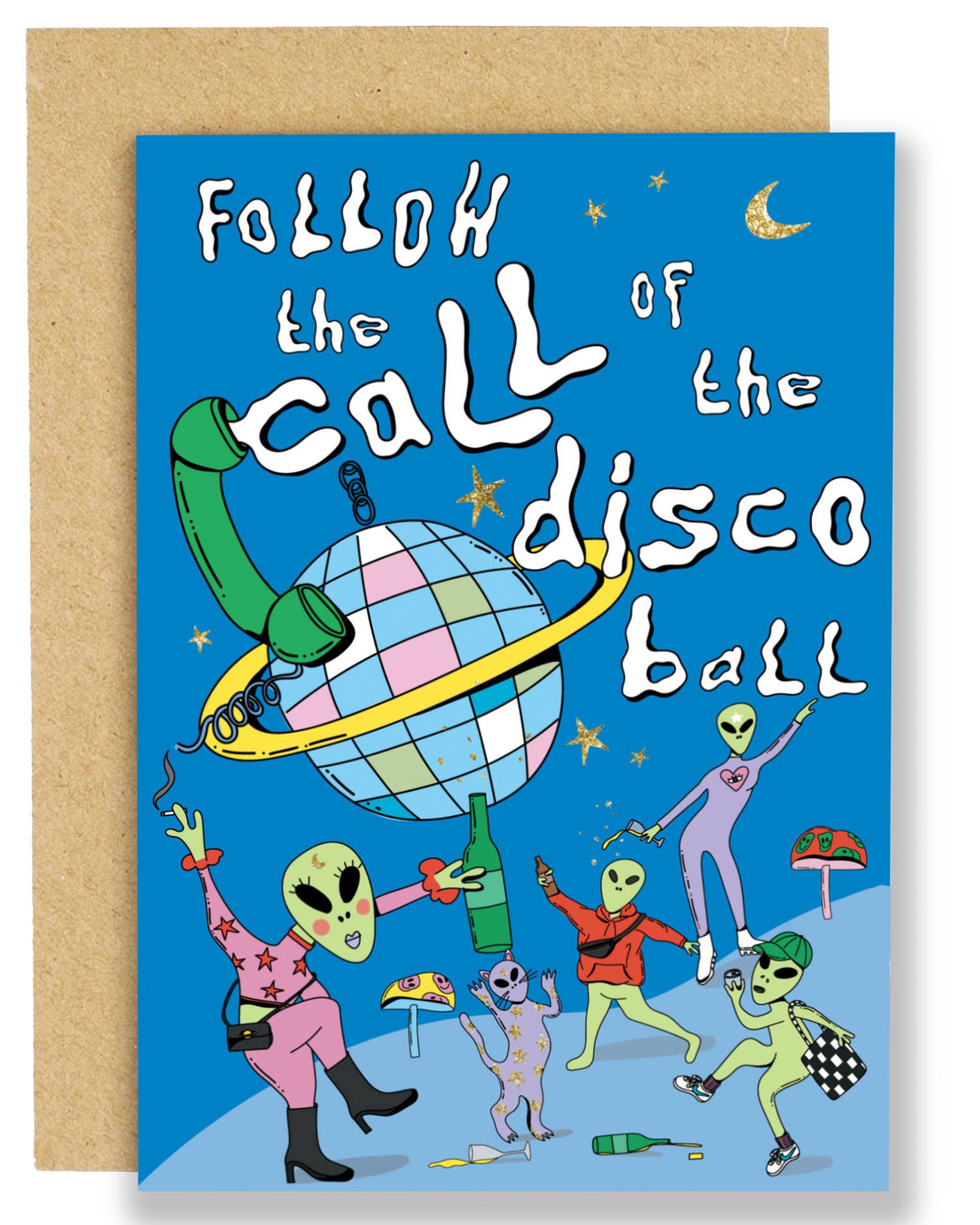 A bright blue birthday card with playful gold foil stars and the text “Follow the call of the disco ball,” featuring quirky green aliens in colourful outfits dancing and holding drinks around a giant pastel disco ball with a phone cord wrapped around it.