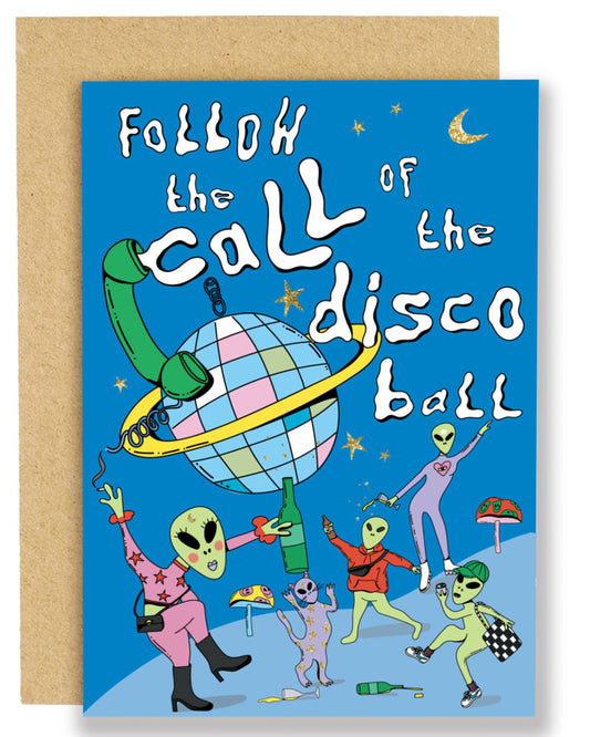 A bright blue birthday card with playful gold foil stars and the text “Follow the call of the disco ball,” featuring quirky green aliens in colourful outfits dancing and holding drinks around a giant pastel disco ball with a phone cord wrapped around it.
