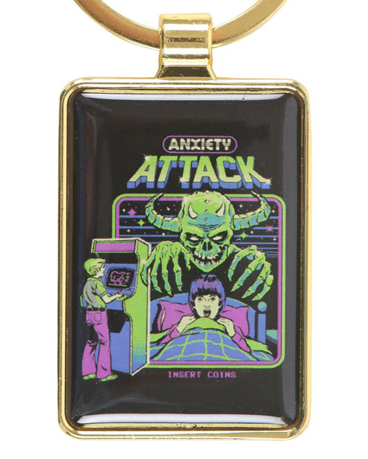 Rectangular Anxiety Attack keyring by Steven Rhodes, featuring retro arcade-inspired artwork of a green goblin-like monster looming over a terrified child in bed. A nostalgic alternative accessory sold by Rebel Romance, a UK small business celebrating quirky, gothic and retro gifts for millennials.