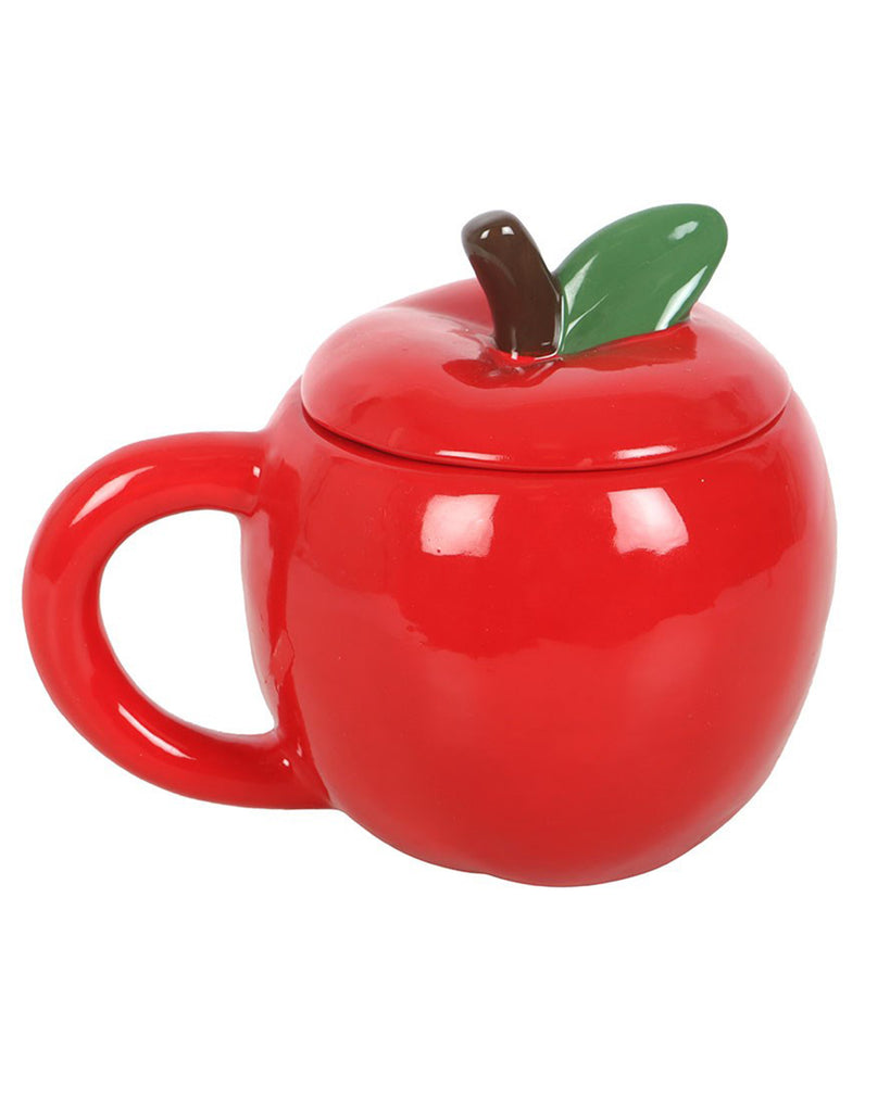 Glossy red apple-shaped mug with a lid featuring a green leaf and brown stem handle, shown on a plain white background.
