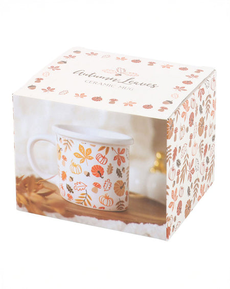 The mug's packaging box, decorated with the same autumnal leaf and pumpkin pattern as the mug. The box reads "Autumn Leaves Ceramic Mug" and features an image of the mug on a rustic wooden surface with autumn leaves.