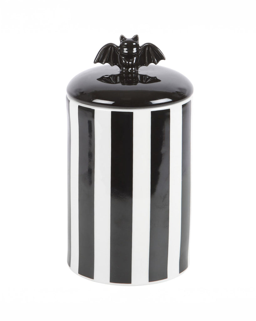 A full view of the ceramic bat storage jar, with its striking monochrome stripes and unique bat topper. Ideal for those who embrace bold, goth alternative homeware.