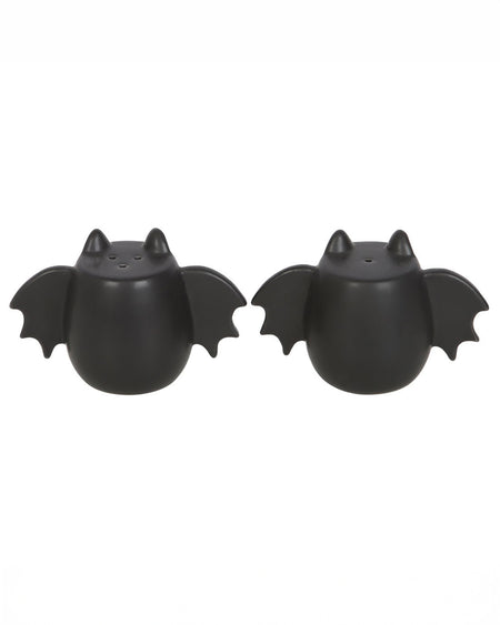 A close-up of the bat wing salt and pepper shakers, showcasing their matte black ceramic finish and unique winged design. A stylish and spooky addition to any kitchen.