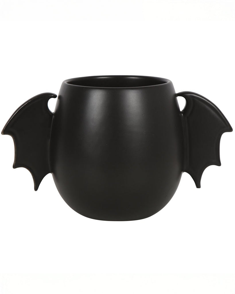 Front-facing view of the Bat Wing Mug with sculpted bat wing handles on each side and a sleek, matte black finish. A perfect gothic alternative to traditional mugs.