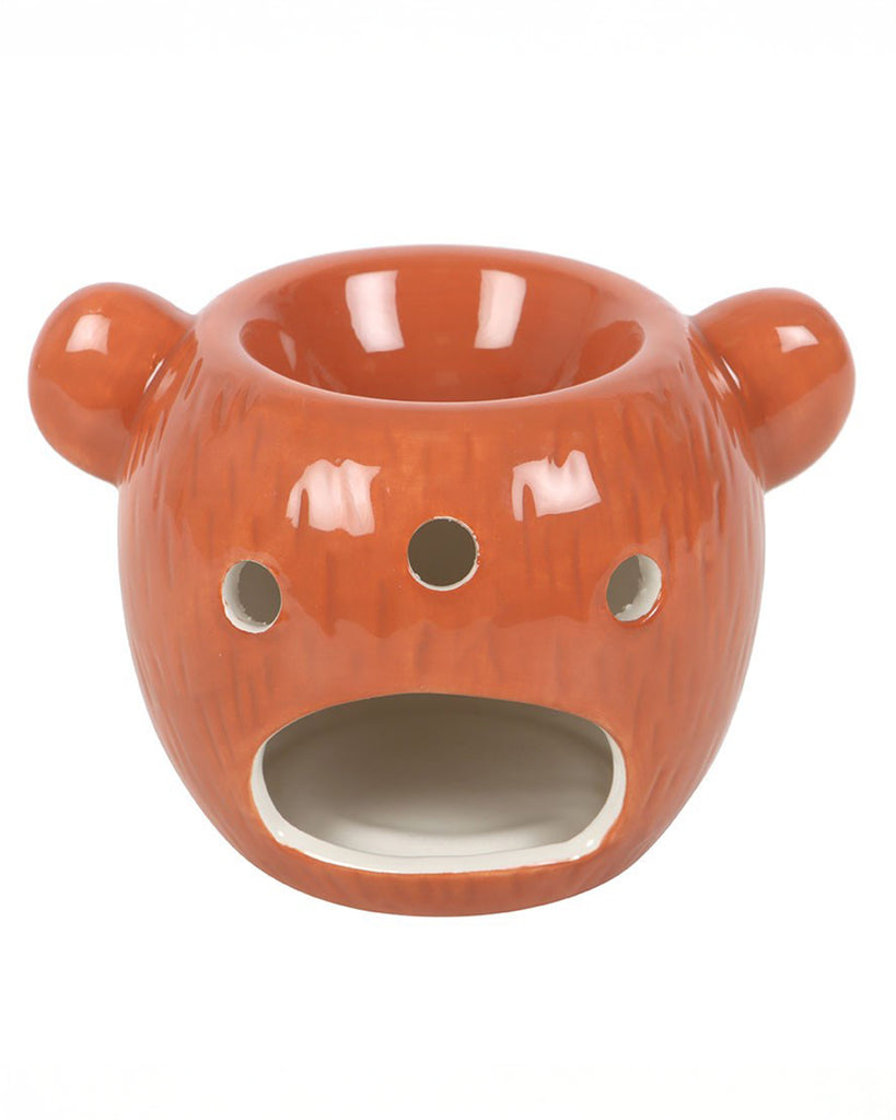 Back view of the Rebel Romance Bear Shaped Oil Burner in glossy brown ceramic, showing vent holes and an opening for a tealight. This quirky bear home fragrance burner is perfect for diffusing essential oils and filling your room with warm, relaxing scents.