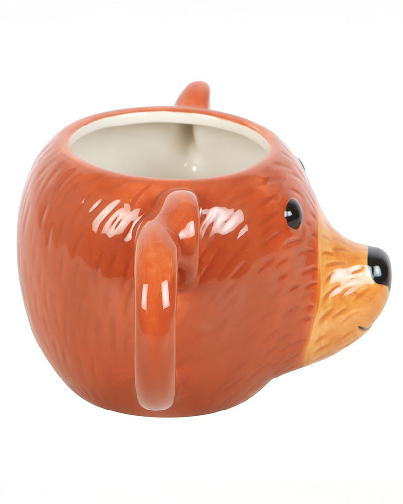 Side view of the Rebel Romance Bear Shaped Mug showing the handle and the bear's cute snout. The glossy ceramic design makes this novelty mug a charming addition to your unique mug collection.