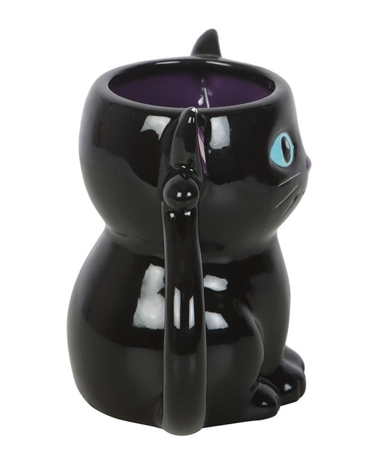 Side view of the Rebel Romance Cute and Creepy Black Cat Mug. The ceramic mug features a curled tail handle, purple inner glaze, and 3D black cat shape with detailed eyes, whiskers, and paws—perfect for witchy, alternative homeware lovers.