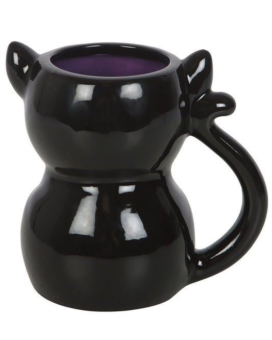 Back view of the Rebel Romance Cute and Creepy Black Cat Mug showing the glossy black ceramic finish, purple interior, and curled tail handle. This quirky mug is shaped like a sitting cat and adds a touch of gothic cuteness to your brew time.