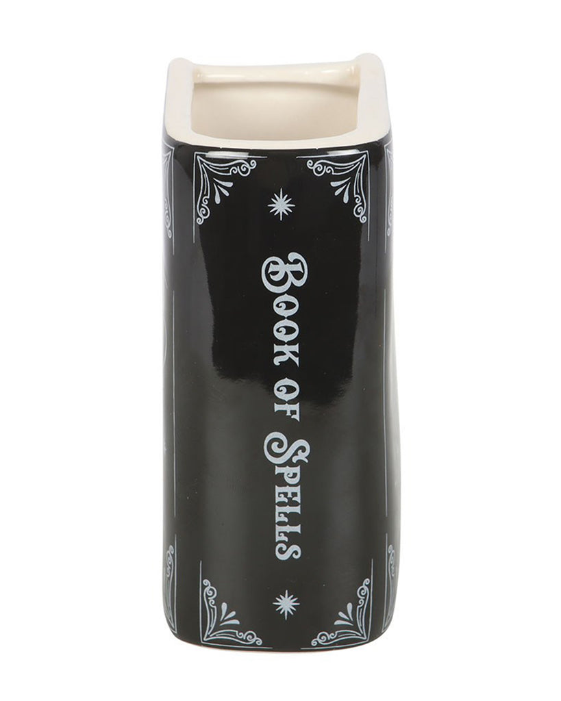 Side view of the Rebel Romance Book of Spells ceramic vase showing the spine with “Book of Spells” in white gothic text. A bewitching detail perfect for witchy bookcases or altar displays.
