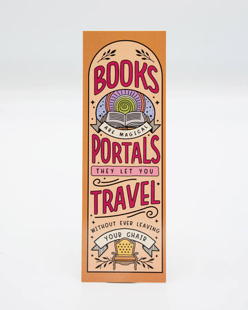 Peach and orange rectangular bookmark with bold pink and purple text reading "Books are magical portals – they let you travel without ever leaving your chair." Features whimsical illustration of an armchair, stars, and an open book. Designed by Rebel Romance, a UK brand known for alternative gifts, homeware, and millennial-friendly slow fashion.