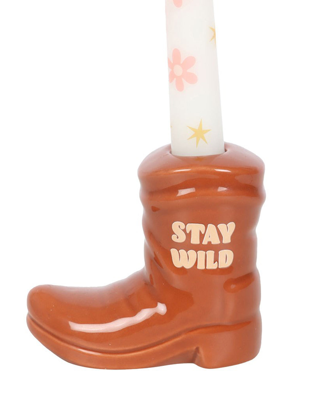 Side view of the brown cowboy boot candle holder by Rebel Romance, with 