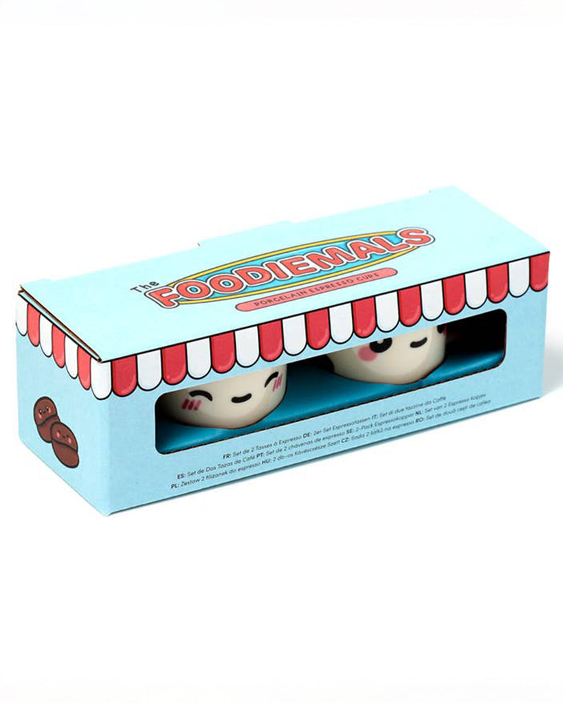 Gift box packaging for Rebel Romance’s Foodiemals espresso cup set. The box is sky blue with a red-and-white striped shop awning design and features two cartoon-style cups peeking through the window.