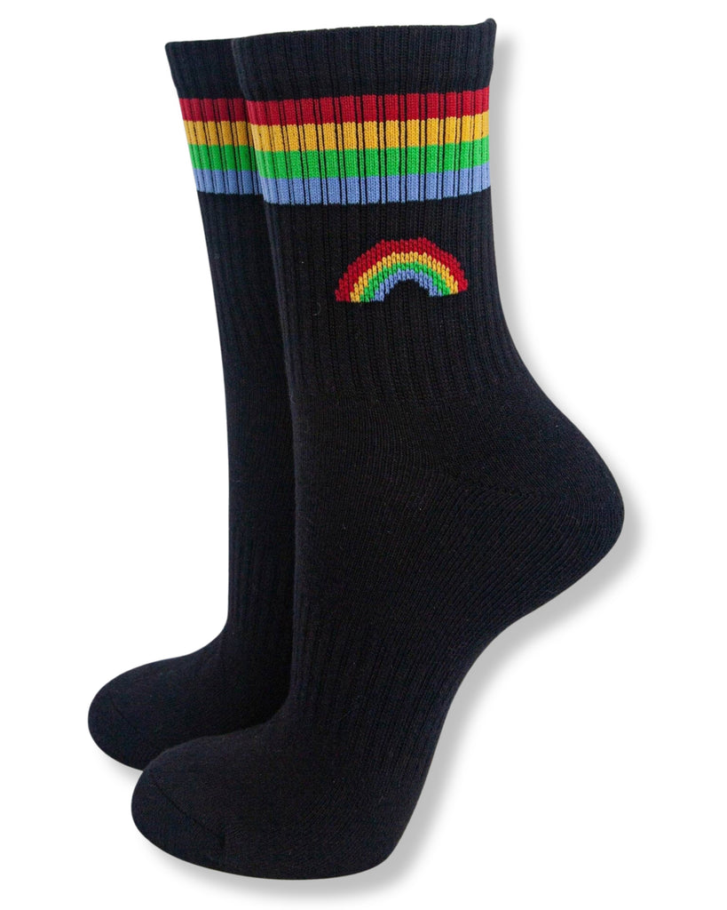 Black socks with rainbow band and embroidered rainbow design on a white background