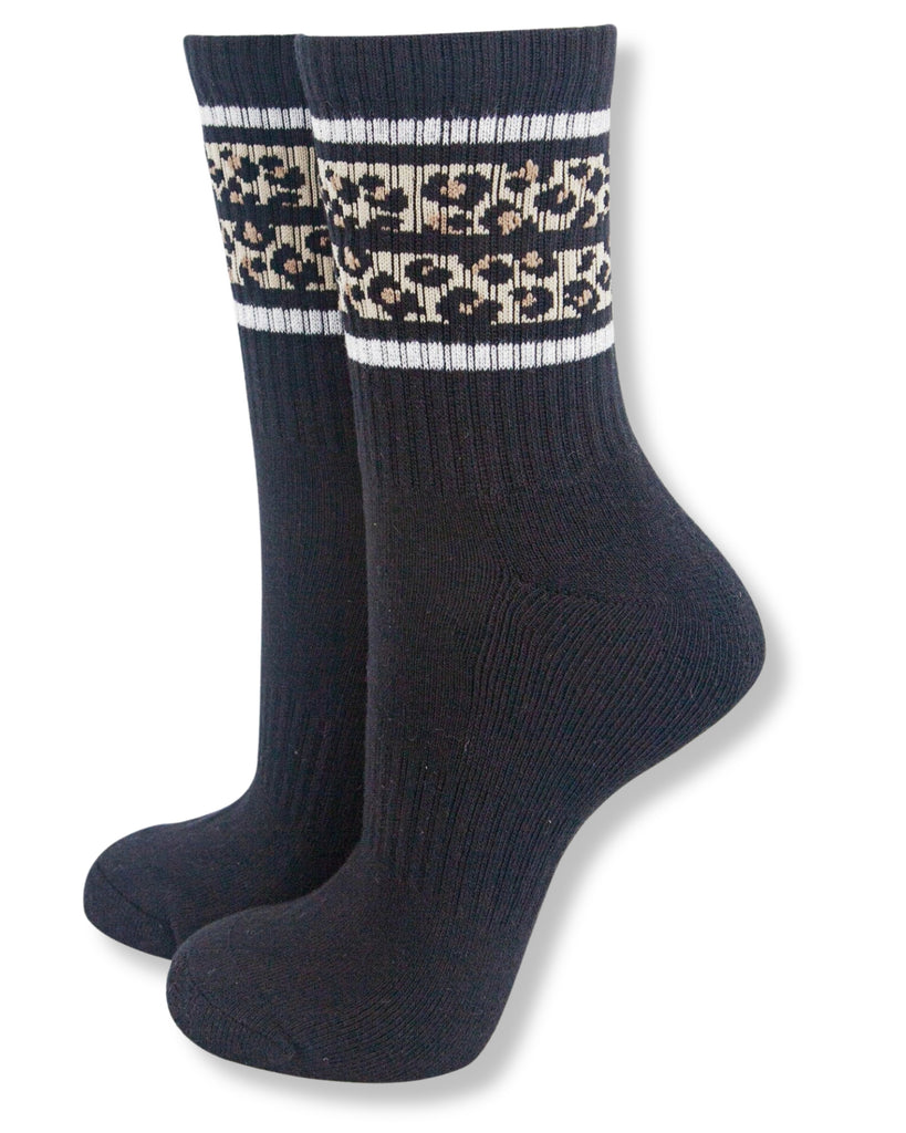 Pair of dark blue socks with a patterned cuff on a white background