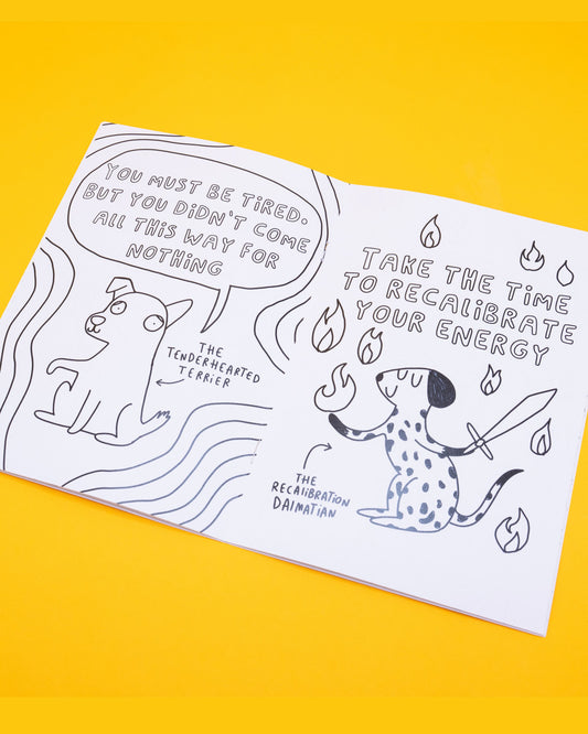 Open page of the Stay Whimsical Magical Colouring Book by Katie Abey, showing black-and-white illustrations. Left page features “The Tenderhearted Terrier” with speech bubble: “You must be tired, but you didn’t come all this way for nothing.” Right page features “The Recalibration Dalmatian” holding a sword with speech: “Take the time to recalibrate your energy.” Sold by a Rebel Romance, a small UK business celebrating individuality through fashion, stationery and gifts. Designed by UK illustrator 