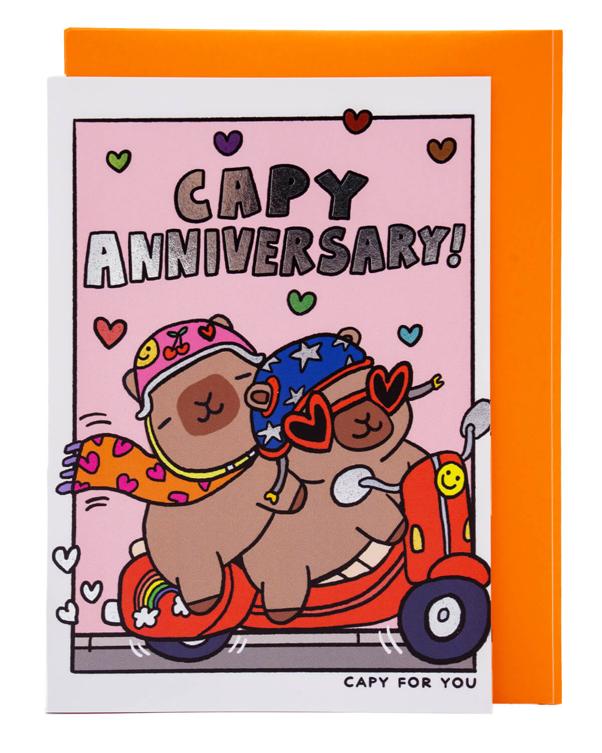 Whimsical Capy Anniversary card from Rebel Romance showing two capybaras cuddled up on a scooter under silver foil text reading “Capy Anniversary!” Adorned with colourful hearts on a pink background, this playful card is ideal for anniversaries, especially for couples who love cute animals and fun, offbeat stationery.