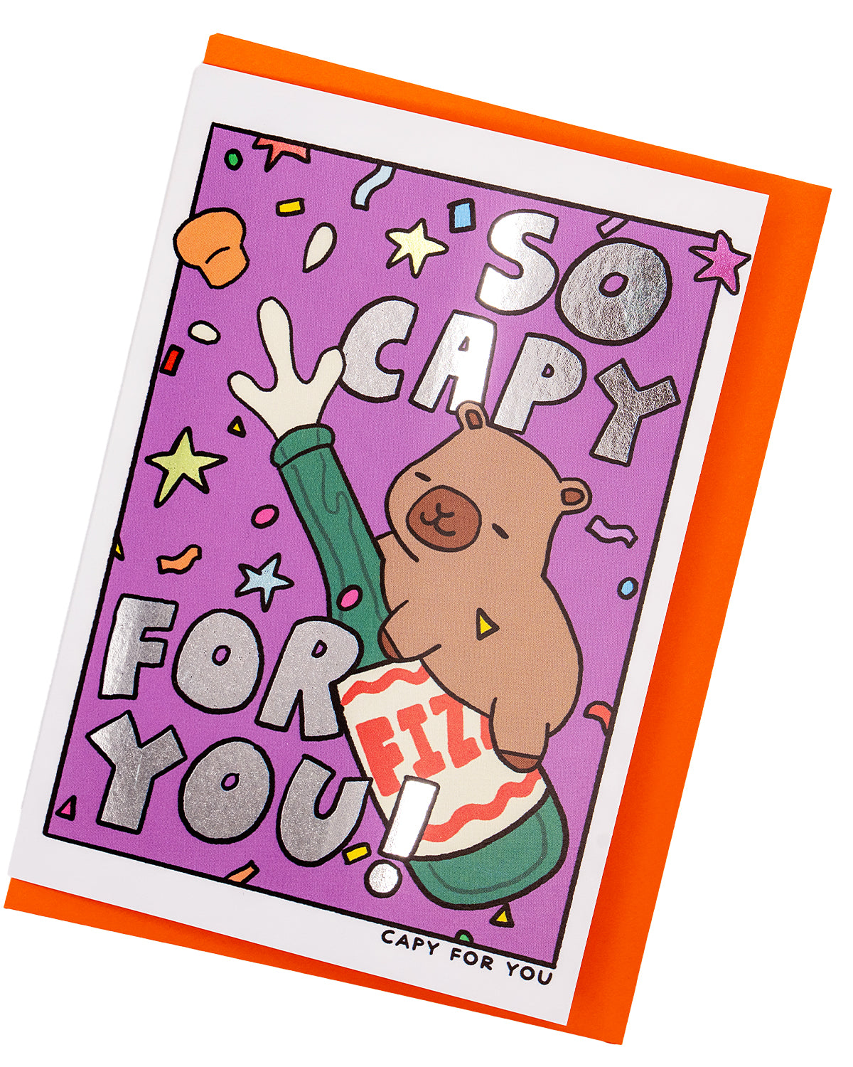 Alternative congratulations card with silver foil lettering reading “So Capy For You!” featuring a cute capybara on a fizz bottle with a confetti-filled purple background. Pictured at an angle with a bold orange envelope, this Rebel Romance card is ideal for celebrating milestones with style, fun, and a dash of cheeky charm.